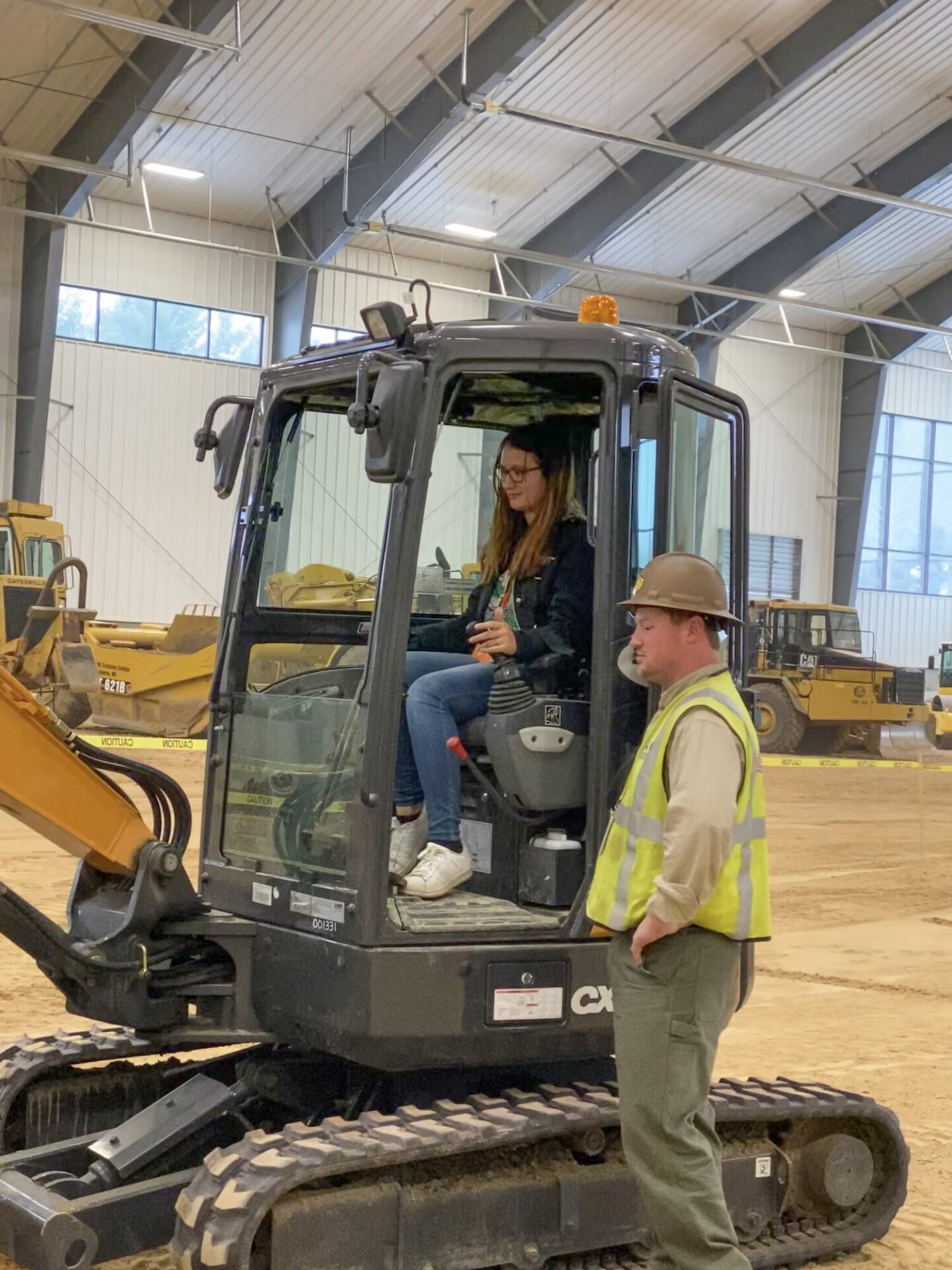 girl learning about excavators