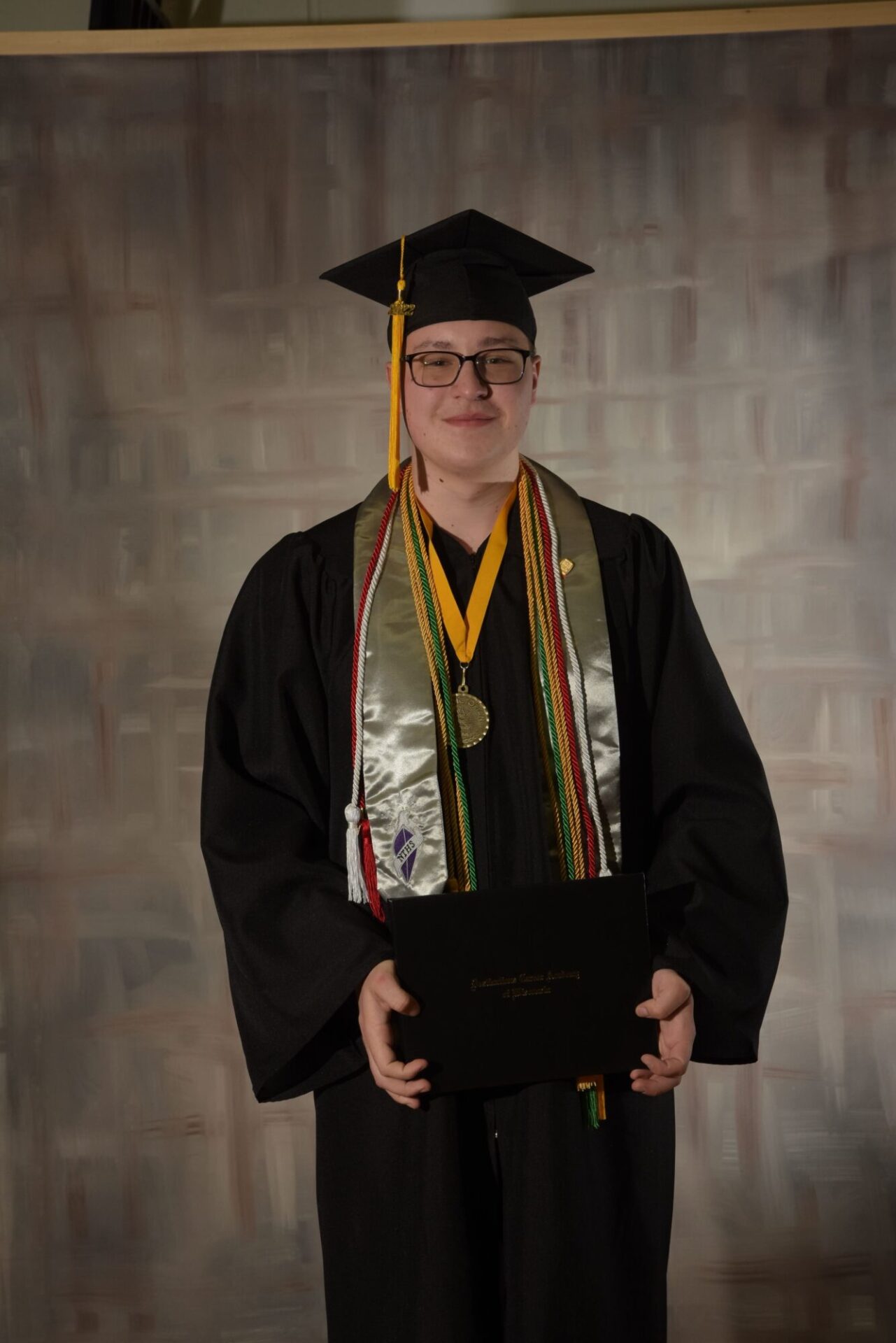 Graduate boy with diploma