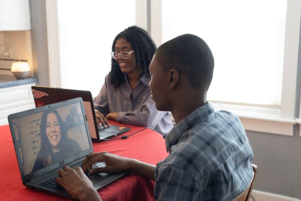 Students doing homework together at home