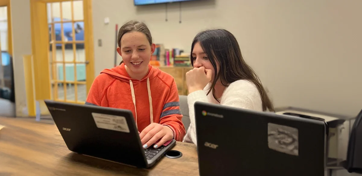 Students working together with their laptops