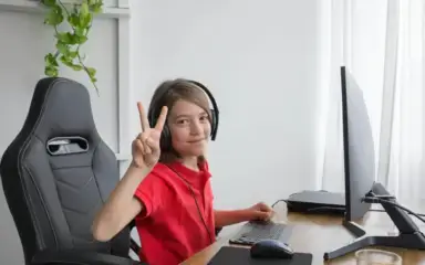 Kid playing in computer