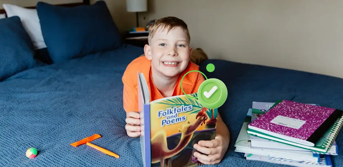 Student reading in bed